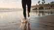 © Vyatcheslav - Low angle view of runner legs jogging on wet beach sand with water splash. Active woman barefoot running at sunset near ocean. Healthy lifestyle and fitness concept