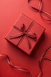 © Anastasiia Kasina - Red gift box on the red background. Copy space, top view