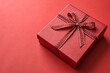 © Anastasiia Kasina - Red gift box on the red background. Copy space, top view
