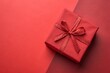 © Anastasiia Kasina - Red gift box on the red background. Copy space, top view