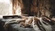 © Roman Luch - Empty tomb with cross and linen cloth inside cave symbolizing resurrection of Jesus