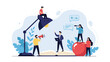 © John - Creative business team working together around oversized objects representing education knowledge and office productivity.