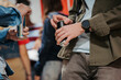 © Halfpoint - Teen students drinking an energy drink in school hallway.