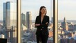 © Alleuy - Professional woman with arms crossed looking out over cityscape through large window sunlight and copy space
