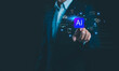 © wanchai peatoo - Artificial intelligence technology concept with businessman pressing AI button on virtual interface, representing machine learning, digital transformation, automation, data analytics, and future.