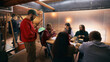 © master1305 - Diverse team discussing ideas during modern office meeting. Concept of collaborative workflow, confident teamwork, business communication for corporate and startup projects.