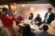 © master1305 - Modern office team collaborating on strategy and project planning. Concept of focused teamwork, confident leadership, corporate workflow for business marketing visuals.
