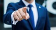 © Sudaporn - Businessman pointing finger directly forward wearing formal attire, symbolizing recruitment, motivation, selection, or challenge