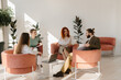 © dsheremeta - Business people collaborating discussing project in modern office