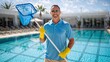 © NN AI - Smiling pool cleaner holding skimmer net. Professional maintenance worker in blue polo and yellow gloves at luxury resort. Swimming pool cleaning and service concept