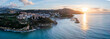 © AmazingAerialAgency - Aerial view of the sun rising over the Tyrrhenian Sea, casting golden light across the water towards the harbor and the town of Agropoli, Italy, Agropoli, Campania Cilento, Italy.