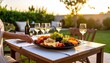 © Adi - Outdoor Dining Table Set For Two With Large Fruit Platter And Wine Glasses In Golden Hour Sunlight