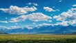 © KimMi - A panoramic mountain range stretching endlessly under a vast sky emphasizing the immensity of nature