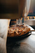 © ADDICTIVE STOCK - Artisan pizza baking in traditional Neapolitan pizzeria