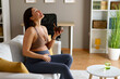 © djile - Pregnant woman finding relief eating oatmeal at home