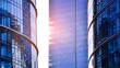 © Grand Warszawski - Modern office building exterior made from glass and steel. Windows of office building. Abstract architectural concept with sunlight.