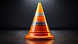 © Joseph - bright orange traffic cone with reflective stripes on black background