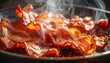 © Nanang - Crispy Bacon Sizzling in a Pan - A Delicious Breakfast Treat.