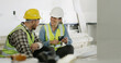 © Kobus Louw/peopleimages.com - Conversation, happy and friends on construction site with phone, colleague gossip or app scroll during work rest. Digital, people and contractors with tech, social chat and online search on break.