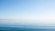 © William - Serene scene with a calm blue ocean merging into a light blue sky