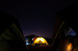 © Nattawit - A camping tent with glowing light inside and beautiful night sky with starts as background. Photo contained some noise due to low light environment.