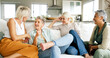 © Kobus Louw/peopleimages.com - Smile, discussion and senior women in living room for bonding, reunion and together in home. Laugh, retirement and group of mature friends on sofa with gossip, communication or conversation in house