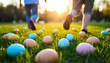 © kulkann - Kids Playing on Sunlit Grass with Easter Eggs During Holiday Picnic