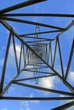 Power transmission tower against blue sky perspective view