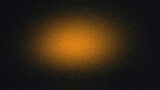 Dark Grainy Background with Central Amber Light Glow
