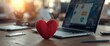 © GenZGraphics - Desk with a Valentine heart near the laptop