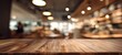 © Studio Nova - The Wooden Table in a Cozy Modern Cafe with Warm Bokeh Lighting