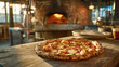 © valeo5 - authentic neapolitan pizza with melted mozzarella and tomato sauce on rustic wooden table in traditional italian pizzeria with blurred wood fired stone oven flaming in the background professional