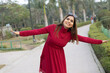 © Pix4Ads - Portrait of Attractive, cheerful indian happy and active woman feeling care ree and joyful expressing happiness with outstretched arms and fun in a park. during the nice autumn day. Happy Woman Day.
