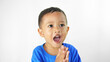 © PinkyEn - A preschool-aged Asian boy, clapping and cheering happily, smiling proudly with his hands together, isolated on a white background.