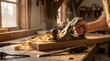 © Vasilii - A close-up shot of the woodworking process in a sunny workshop: a man's hands confidently guide a plane across a wooden board, producing long, curling shavings.