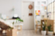 © Pixel-Shot - Blurred view of light office with printer on commode, door and workplace