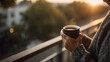 © Marvel’s Nook - Morning coffee senior moment with elderly person holding cup on balcony at sunrise, enjoying peaceful start of the day with warm drink and natural light in cozy outdoor setting
