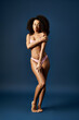 © Bliss - Stunning young African American woman in stylish swimwear poses elegantly in the studio
