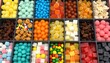 © Monster - Assortment of colorful candies and dried fruits in a divided tray for a sweet treat selection