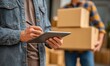 © koosy - Delivery Team Confirming Shipment Details, the process of verifying and organizing deliveries. Ideal for logistics, e-commerce, or delivery service marketing materials.