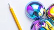 © Kupat - Shiny, colorful orbs reflect light near a sharpened pencil on white surface