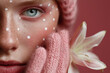 © Femmes.Digital - A fashion close-up showing a woman's eye and hand in pink knit gloves, holding a white lily against a pink background. Editorial floral beauty with cozy and modern textures.