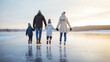 © Bonsales - Family ice skating together on a natural frozen lake during golden hour, enjoying winter leisure and bonding