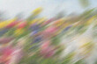 © Naznin - Artistic motion blur background with grainy texture and multicolored floral hues suitable for soft romantic themes or posters