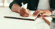 © peopleimages.com - Man, hands and writing in office with notebook for journalism investigation, story development or plan. Person, taking notes and agenda in workplace with journal for creativity, news or article idea.