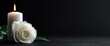 © Konstantin - White rose flower with burning candle on black background symbolizing mourning grief loss condolence sympathy remembrance memorial funeral death sorrow tribute sadness spiritual purity peace