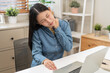 © KMPZZZ - Body muscles hurt stiff, face suffering asian young woman, girl neck pain, body ache while sitting work at home, holding massaging rubbing back, problem health care of office syndrome people concept.