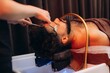 © Roman - Man receiving focused head spa scalp treatment. Japanese spa head