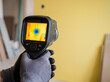 © Aurora Aesthetics - Professional inspector using thermal camera to find hidden water leak in wall house maintenance repair insurance claim background copy space technician service