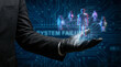 © Vitaliy - A hand in a black glove holds holographic figures representing digital connections. A backdrop of complex circuits hints at hacking and cybersecurity issues. The scene illustrates data protection